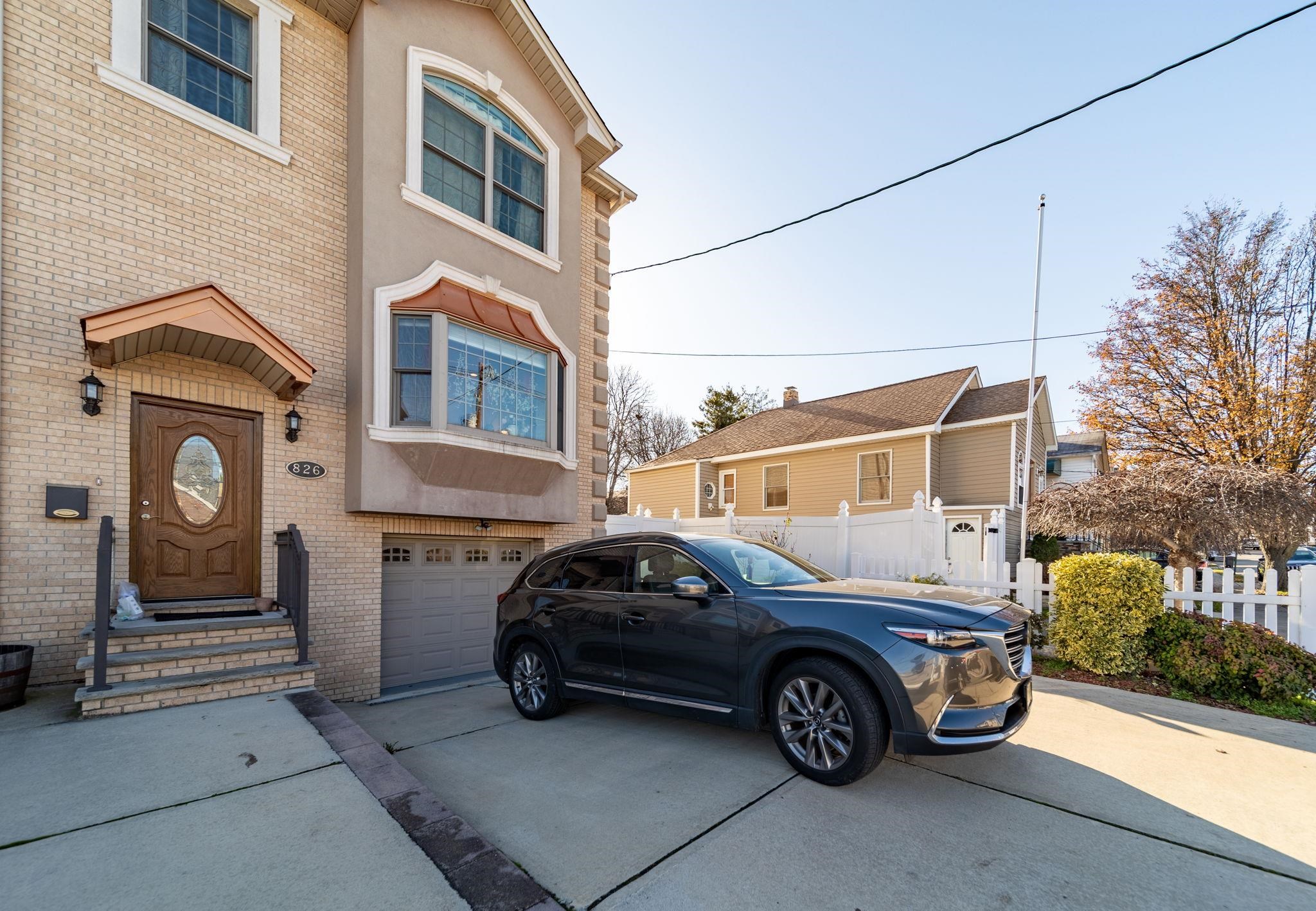 826 Eighth Street Secaucus, NJ 07094 - Photo 11 of 12 a car parked in front of a house