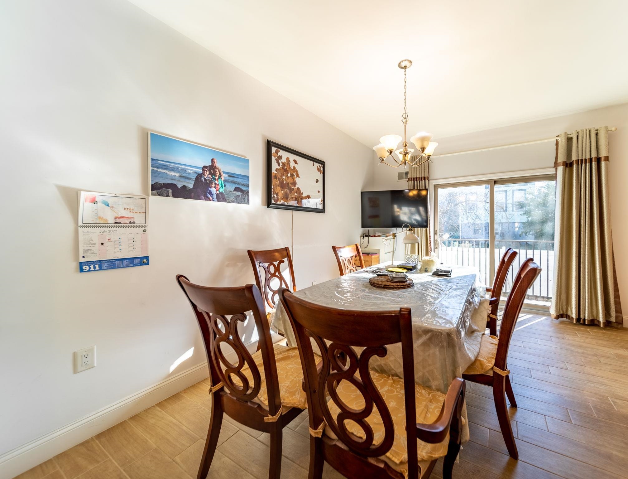 826 Eighth Street Secaucus, NJ 07094 - Photo 8 of 12 a view of a dining room with furniture window and wooden floor