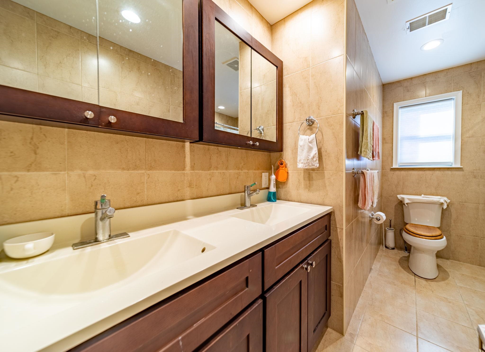 826 Eighth Street Secaucus, NJ 07094 - Photo 10 of 12 a bathroom with a sink and a toilet