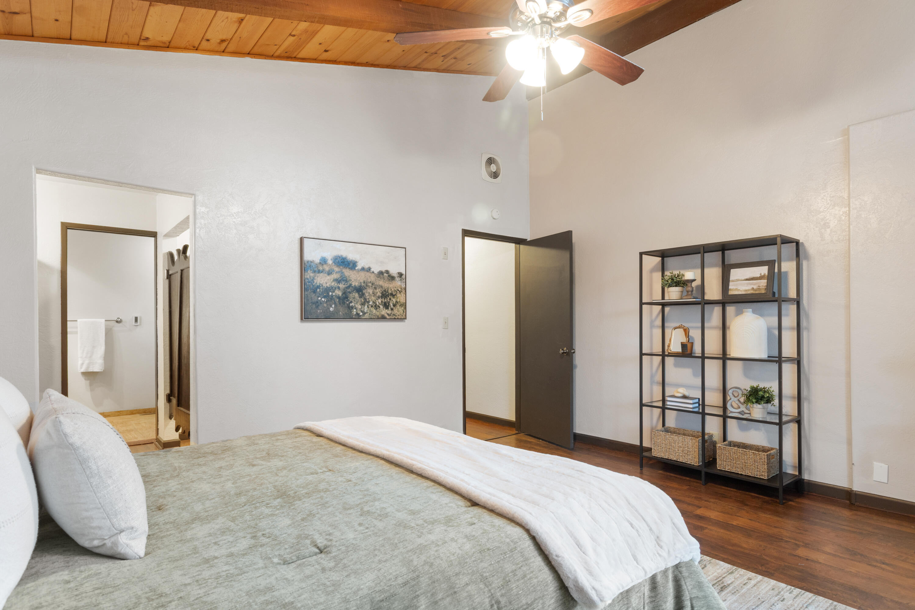 19606 Fish Hill Lane Redding, CA 96003 - Photo 11 of 24 a bedroom with a bed and a chandelier