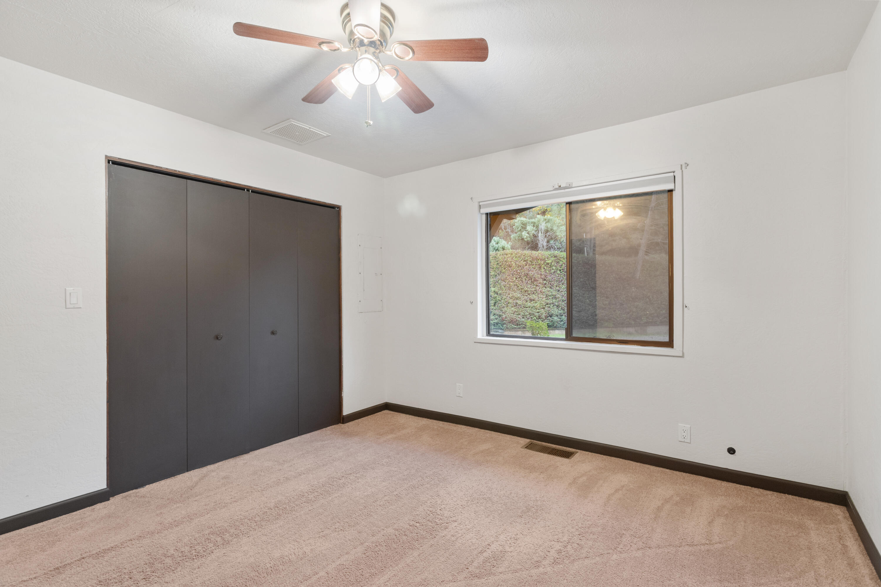 19606 Fish Hill Lane Redding, CA 96003 - Photo 14 of 24 a view of an empty room with a window