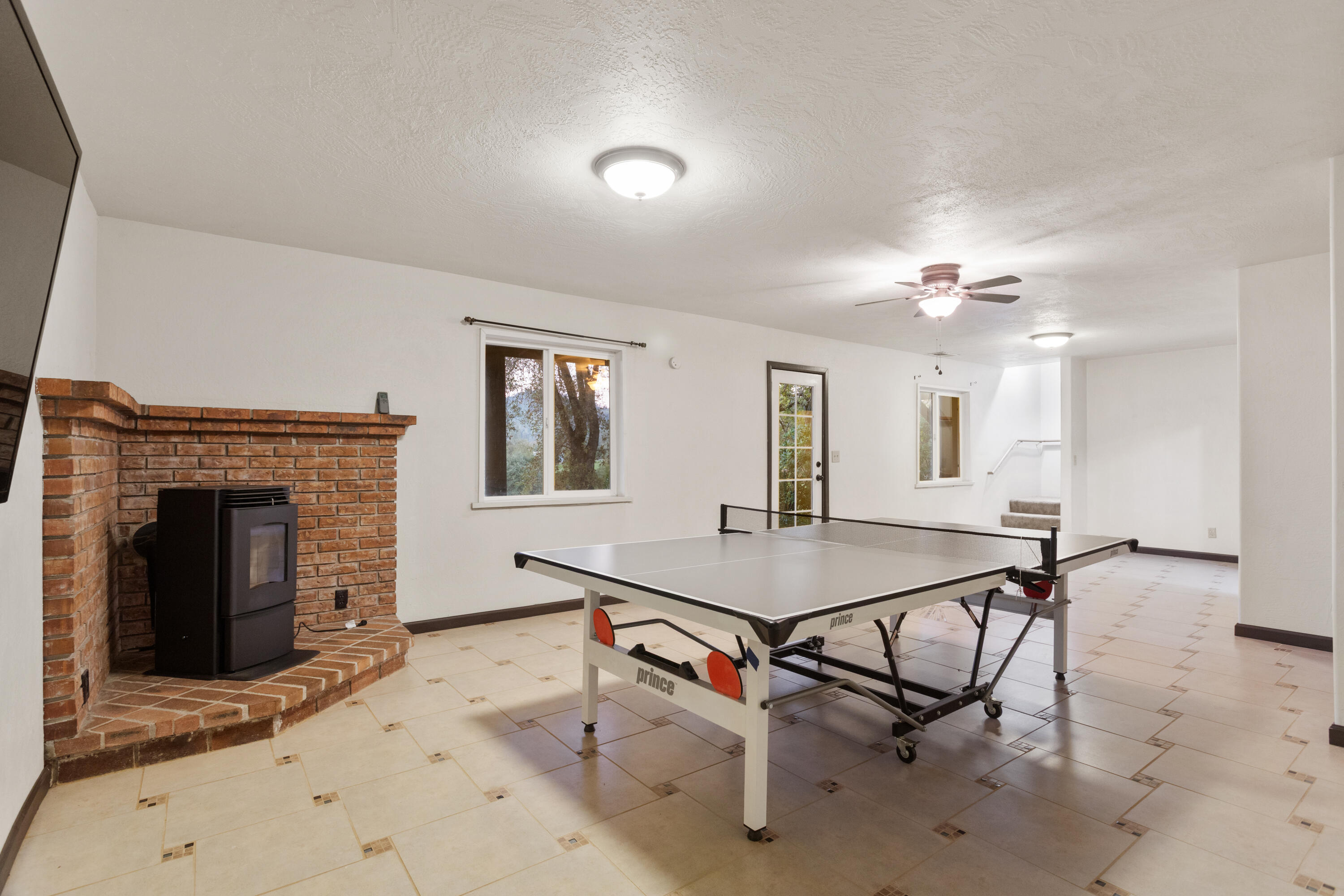 19606 Fish Hill Lane Redding, CA 96003 - Photo 18 of 24 a room with furniture and fireplace