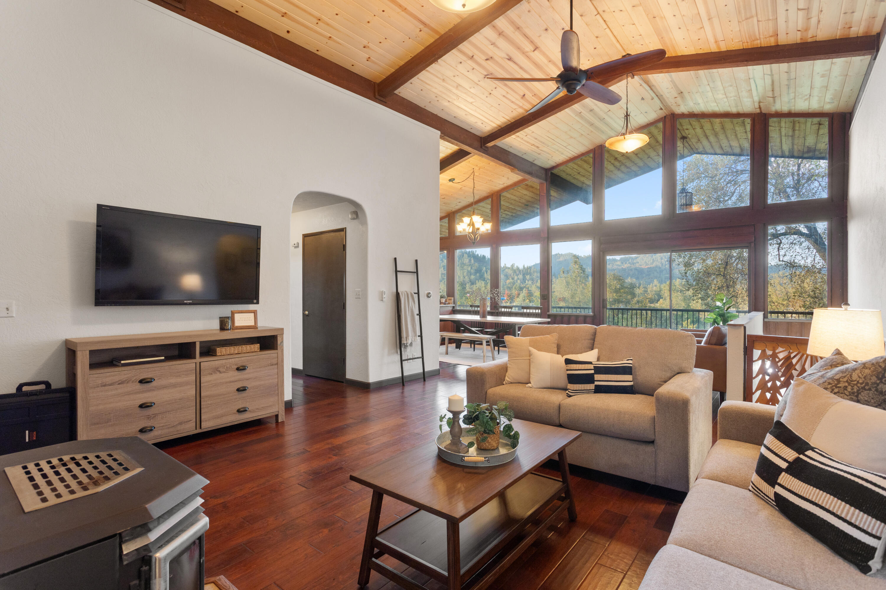 19606 Fish Hill Lane Redding, CA 96003 - Photo 5 of 24 a living room with furniture and a flat screen tv