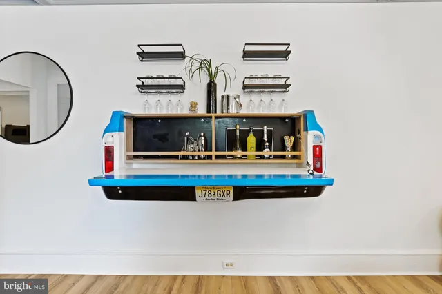 a view of kitchen with stainless steel appliances granite countertop a stove and a microwave