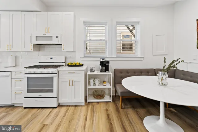 a bedroom with a bed mirror and window