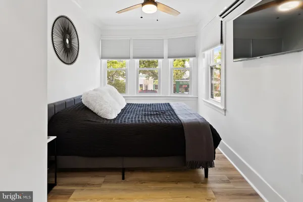 a living room with couch and a large window