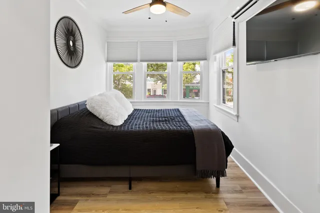 a living room with couch and a large window