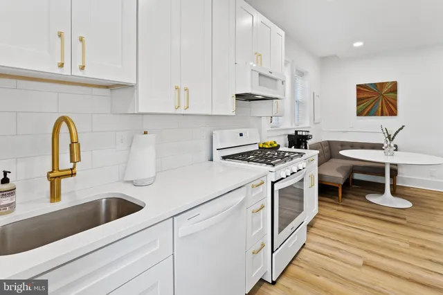 a kitchen with a refrigerator and cabinets
