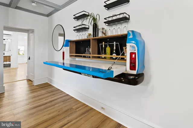 a view of living room with furniture and a fireplace