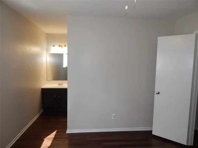 a view of a bathroom with wooden floor