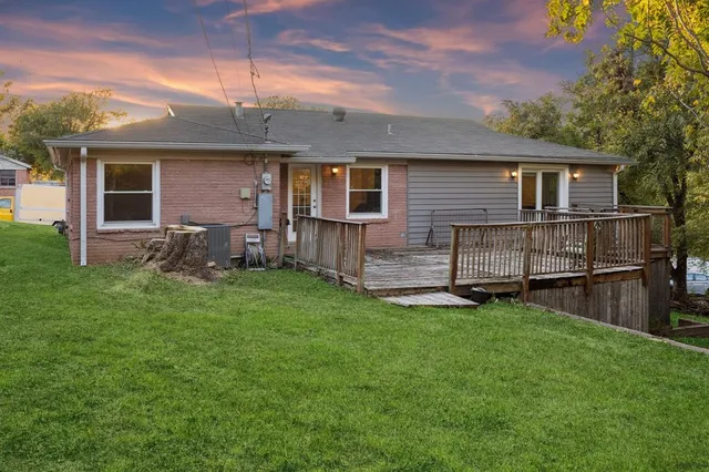 a front view of house with yard and outdoor seating