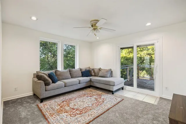 a living room with furniture and a rug