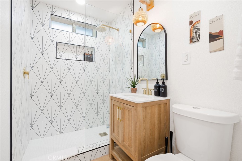 62046 Mountain View Circle Joshua Tree, CA 92252 - Photo 15 of 69 a bathroom with a sink a toilet and shower