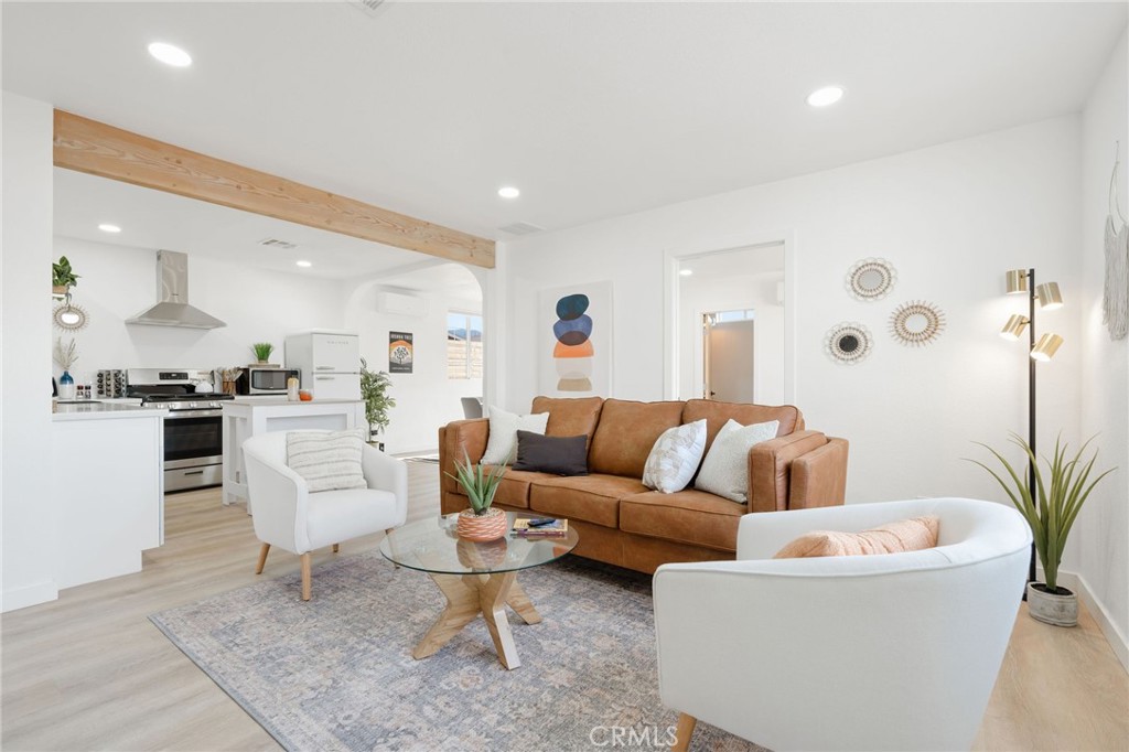 62046 Mountain View Circle Joshua Tree, CA 92252 - Photo 2 of 69 a living room with furniture and kitchen view