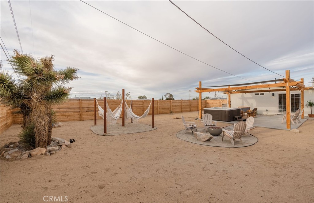 62046 Mountain View Circle Joshua Tree, CA 92252 - Photo 50 of 69 a view of a terrace with furniture
