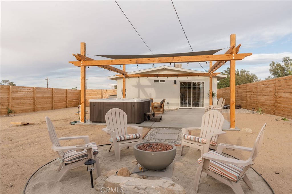 62046 Mountain View Circle Joshua Tree, CA 92252 - Photo 51 of 69 a outdoor space with patio the couches and pool table with chairs