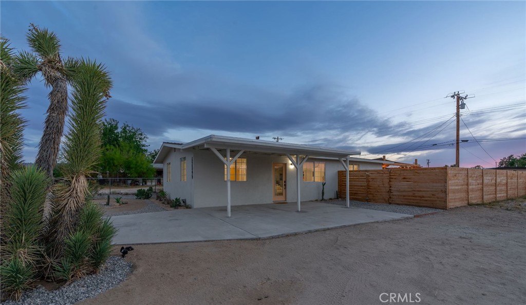 62046 Mountain View Circle Joshua Tree, CA 92252 - Photo 58 of 69 a view of a house with a yard and garage