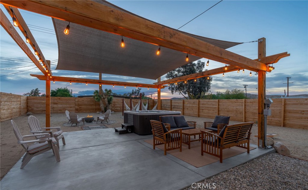 62046 Mountain View Circle Joshua Tree, CA 92252 - Photo 60 of 69 a outdoor space with patio lots of furniture