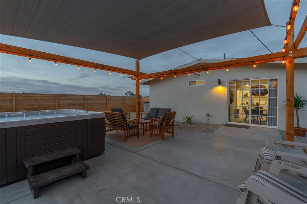 62046 Mountain View Circle Joshua Tree, CA 92252 - Photo 63 of 69 a view of a patio with table and chairs