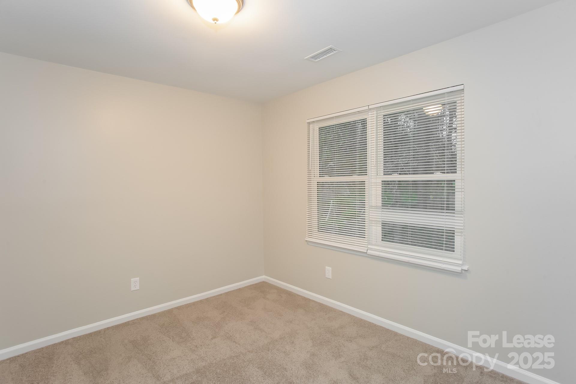 10321 Roundhouse Circle Mint Hill, NC 28227 - Photo 11 of 17 an empty room with a window