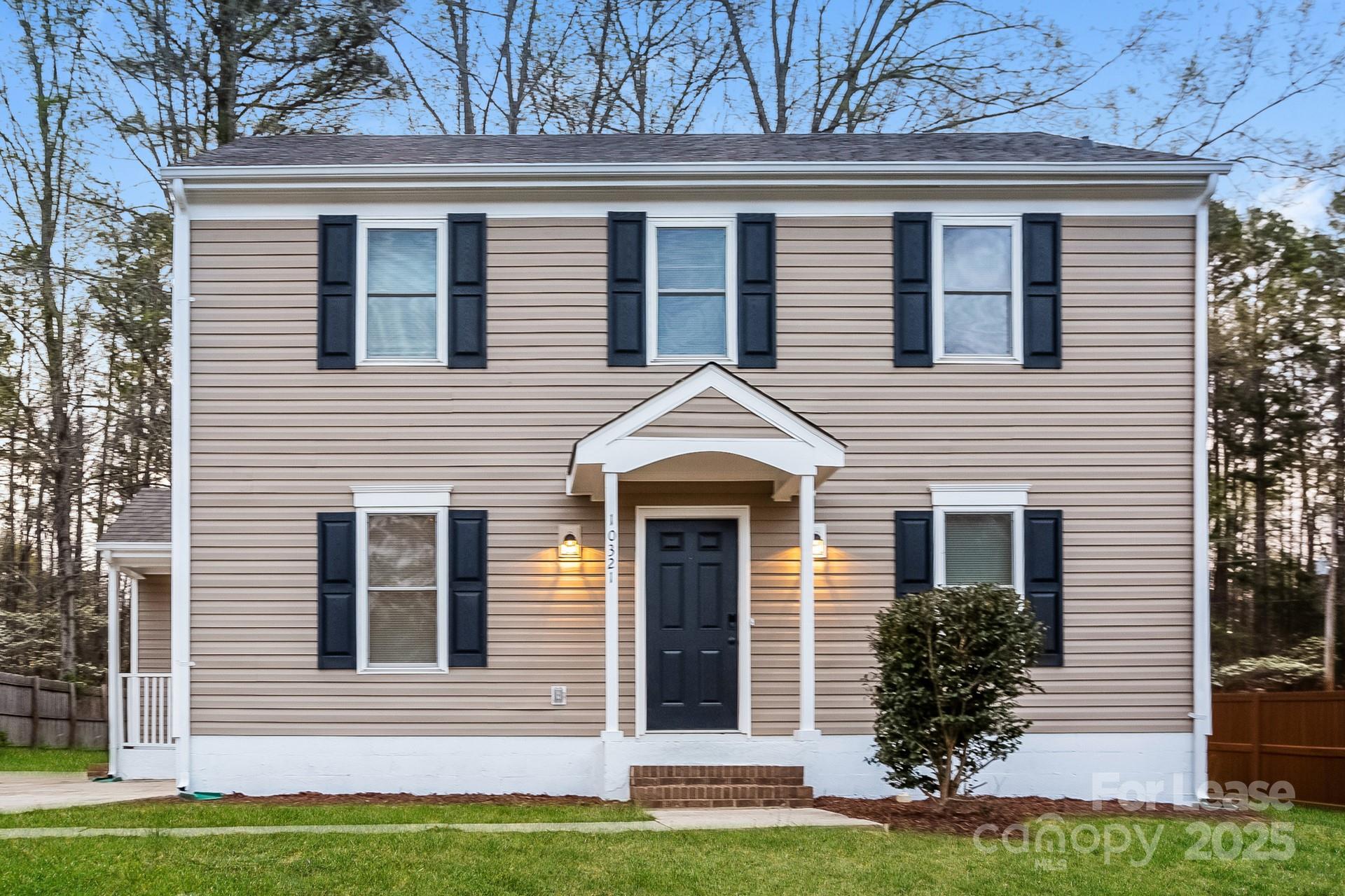 10321 Roundhouse Circle Mint Hill, NC 28227 - Photo 2 of 17 a view of a house with a yard and large window