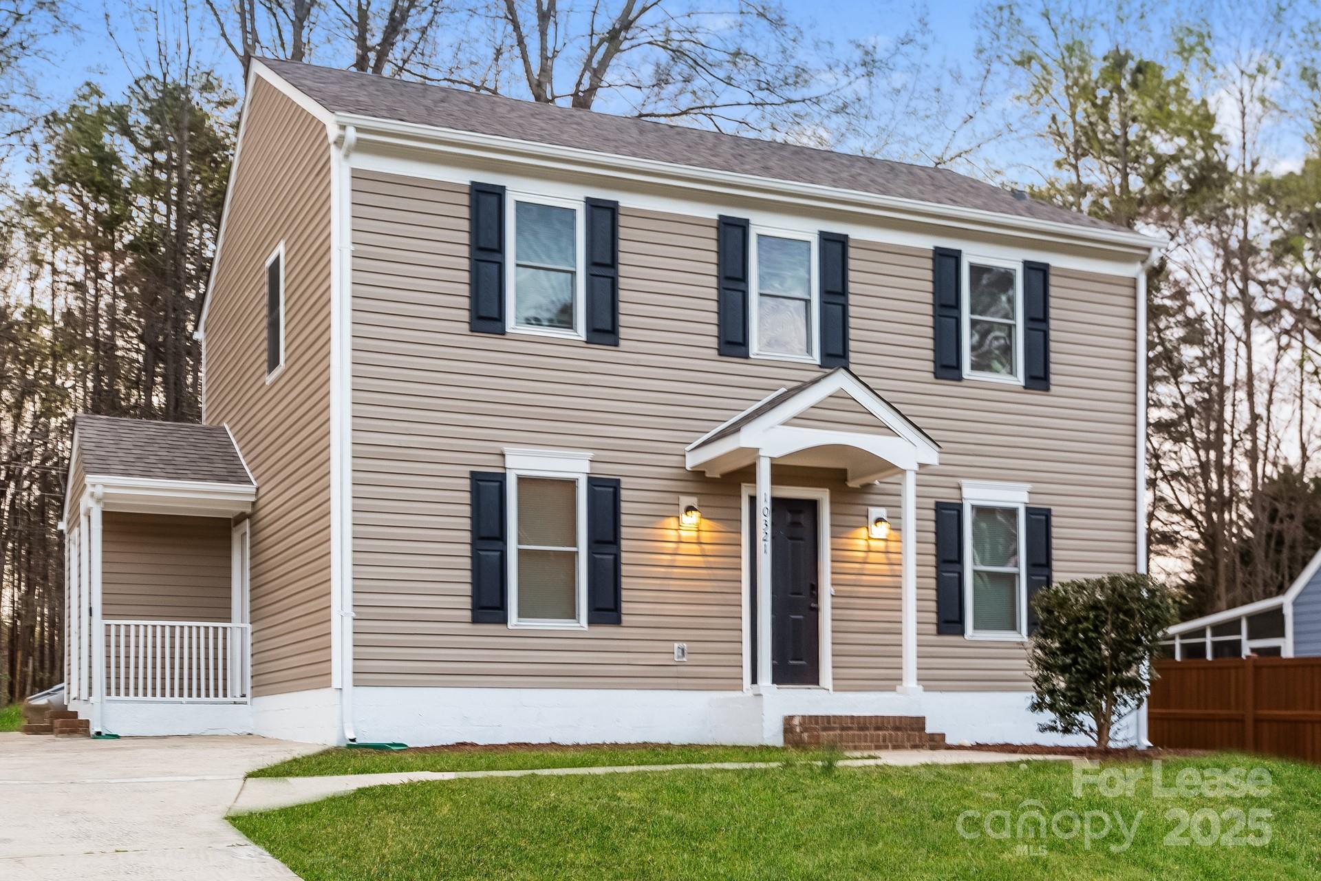 10321 Roundhouse Circle Mint Hill, NC 28227 - Photo 3 of 17 a front view of a house with a garden