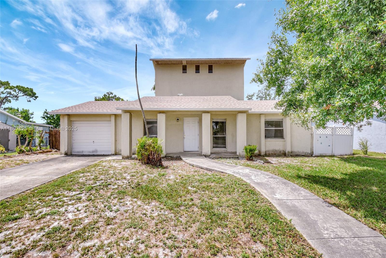 6160 Camp Lee Road West Palm Beach, FL 33417 - Photo 1 of 42 front view of a house with a yard