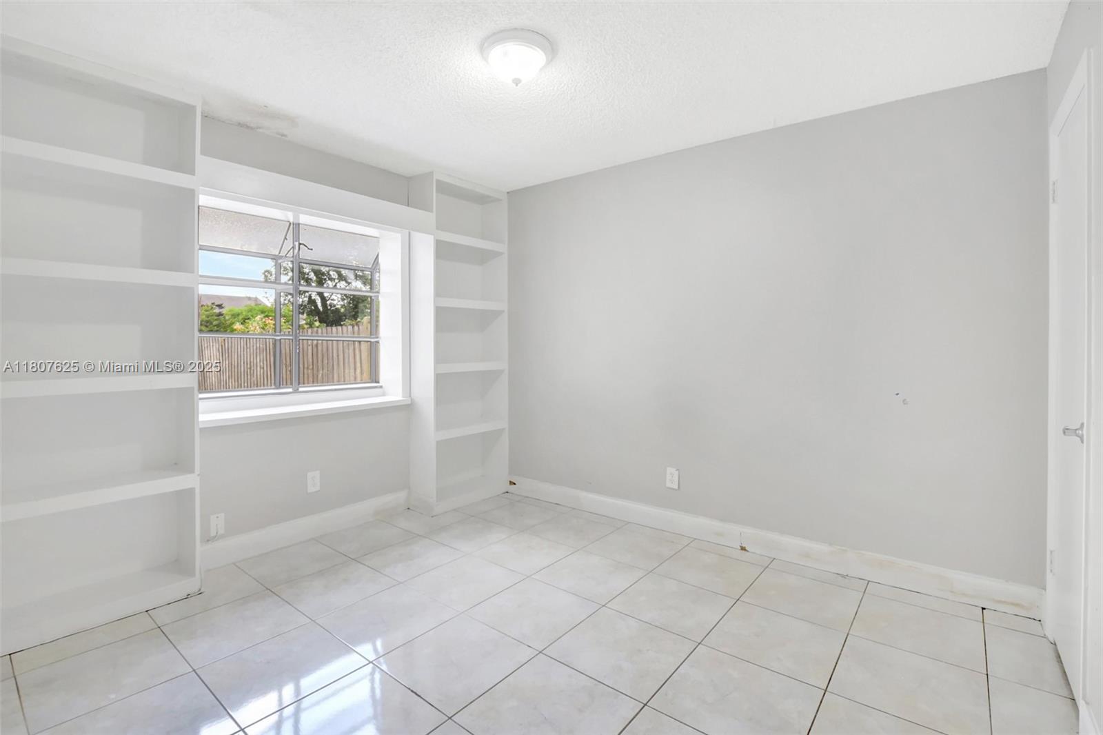 6160 Camp Lee Road West Palm Beach, FL 33417 - Photo 16 of 42 a view of an empty room with a window