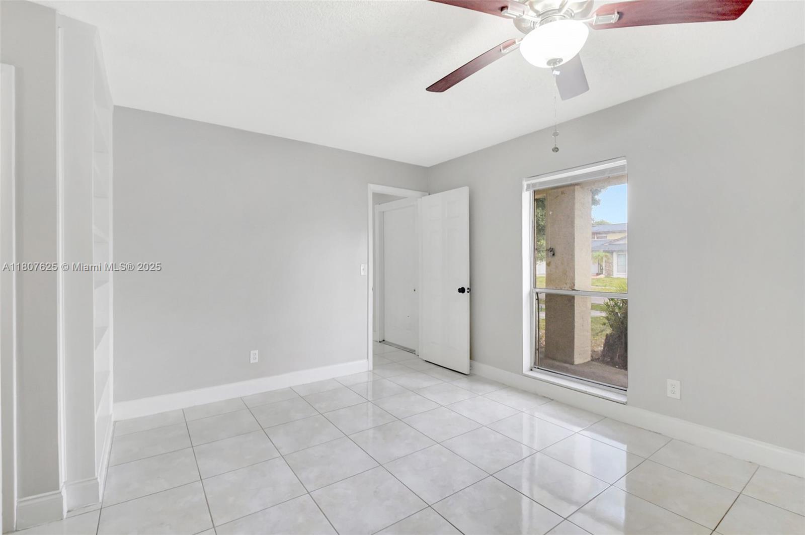 6160 Camp Lee Road West Palm Beach, FL 33417 - Photo 25 of 42 a view of an empty room with a chandelier fan