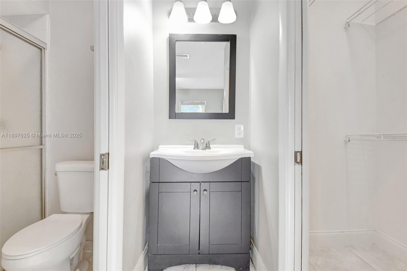 6160 Camp Lee Road West Palm Beach, FL 33417 - Photo 26 of 42 a bathroom with a sink a toilet and shower