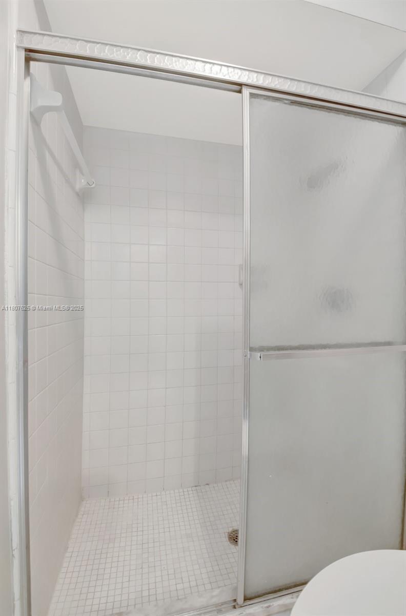 6160 Camp Lee Road West Palm Beach, FL 33417 - Photo 27 of 42 a bathroom with a shower and a toilet