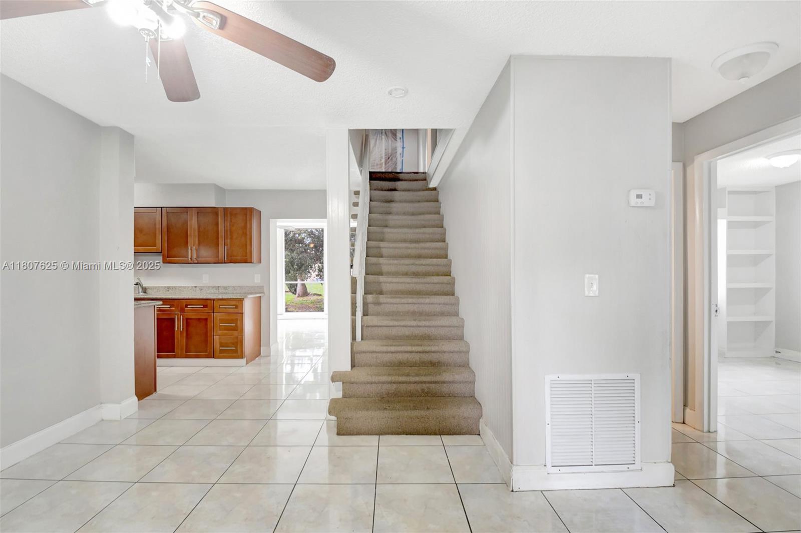 6160 Camp Lee Road West Palm Beach, FL 33417 - Photo 28 of 42 a view of front door and hallway with wooden floor