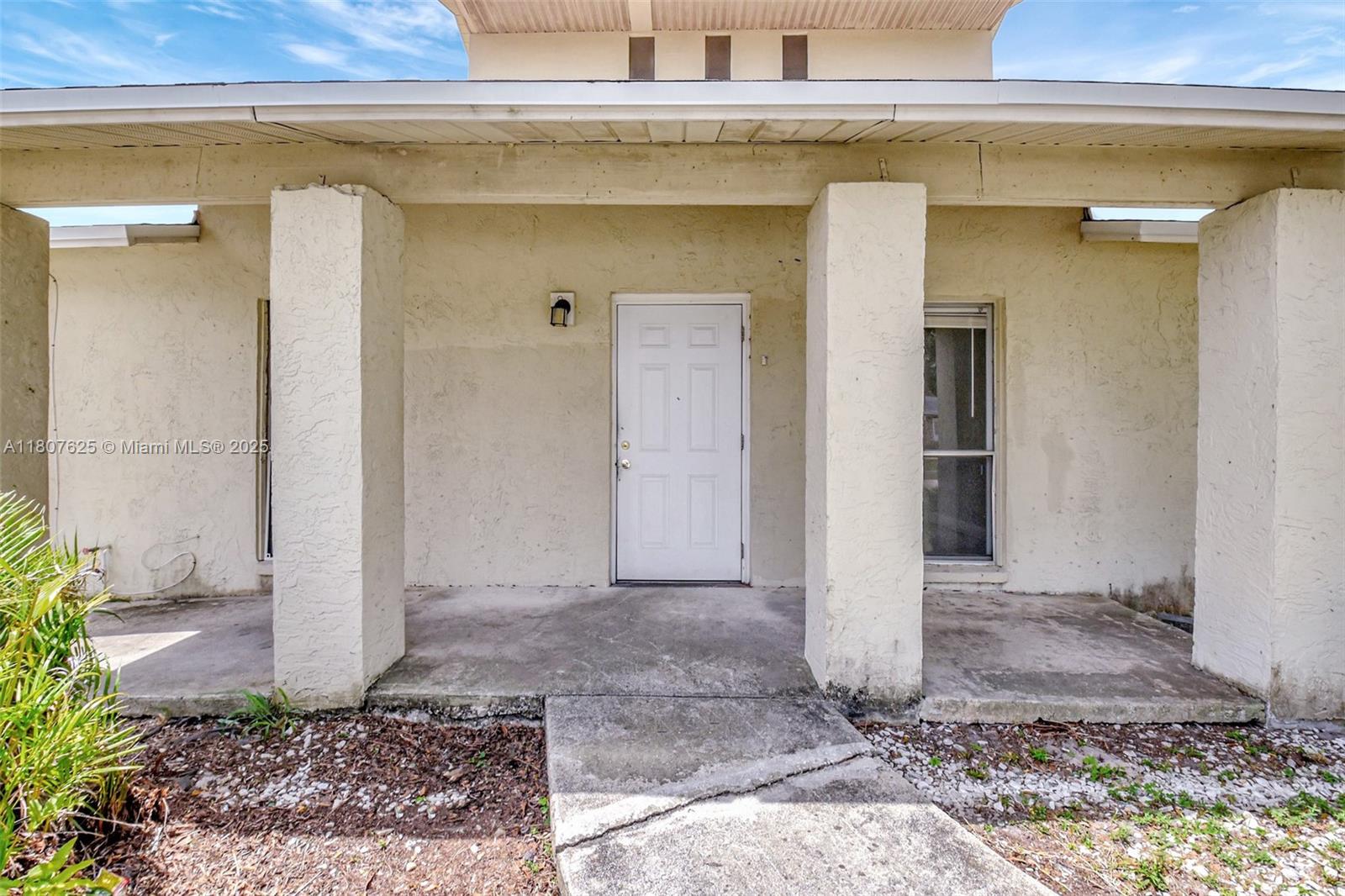 6160 Camp Lee Road West Palm Beach, FL 33417 - Photo 3 of 42 a view of a entrance door of the house