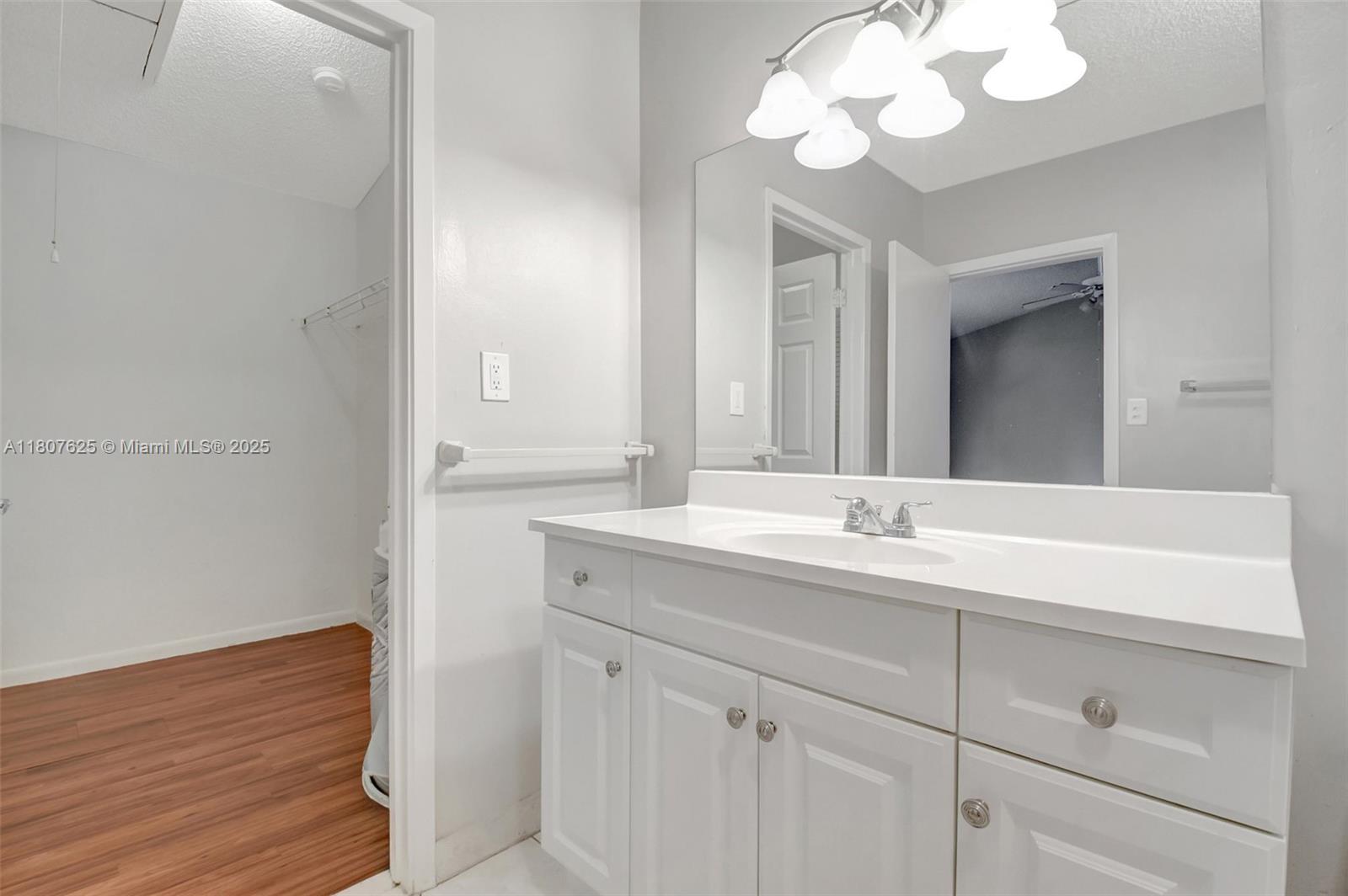 6160 Camp Lee Road West Palm Beach, FL 33417 - Photo 34 of 42 a bathroom with a sink a light fixture and a mirror
