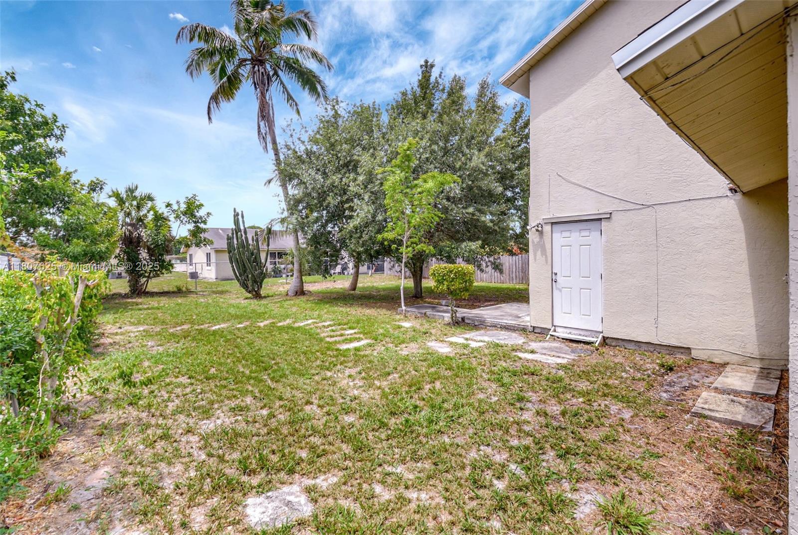 6160 Camp Lee Road West Palm Beach, FL 33417 - Photo 36 of 42 a view of a yard with palm trees