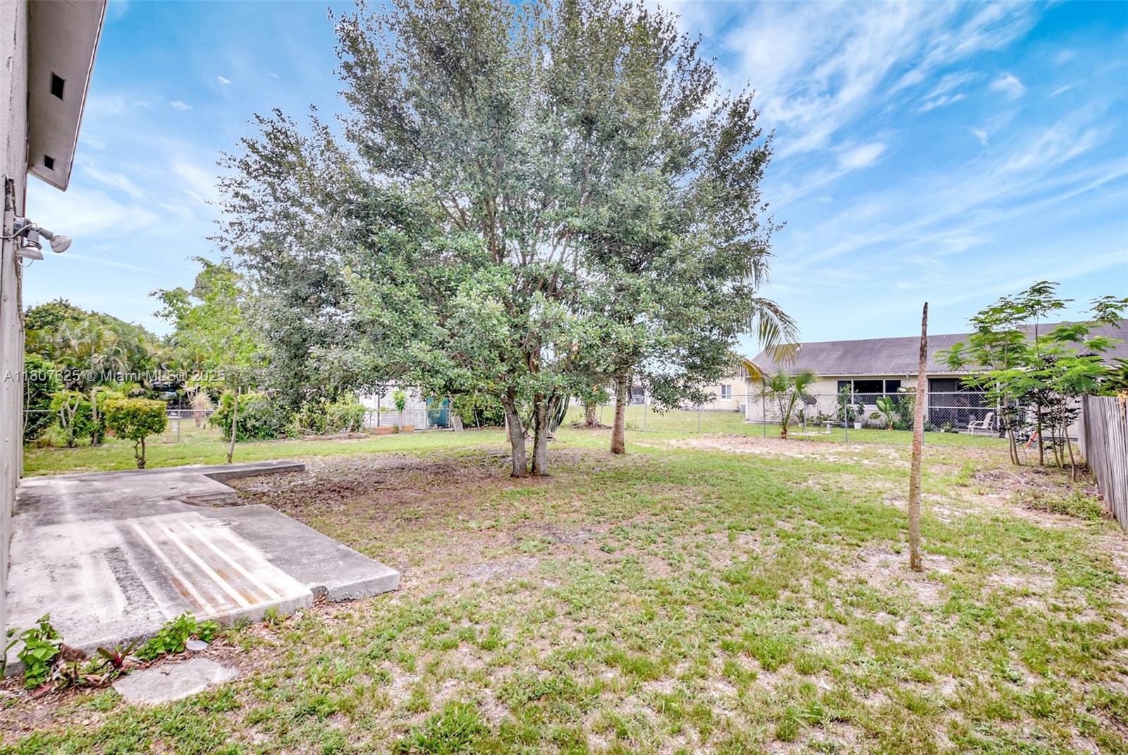 6160 Camp Lee Road West Palm Beach, FL 33417 - Photo 40 of 42 a view of a yard with a tree
