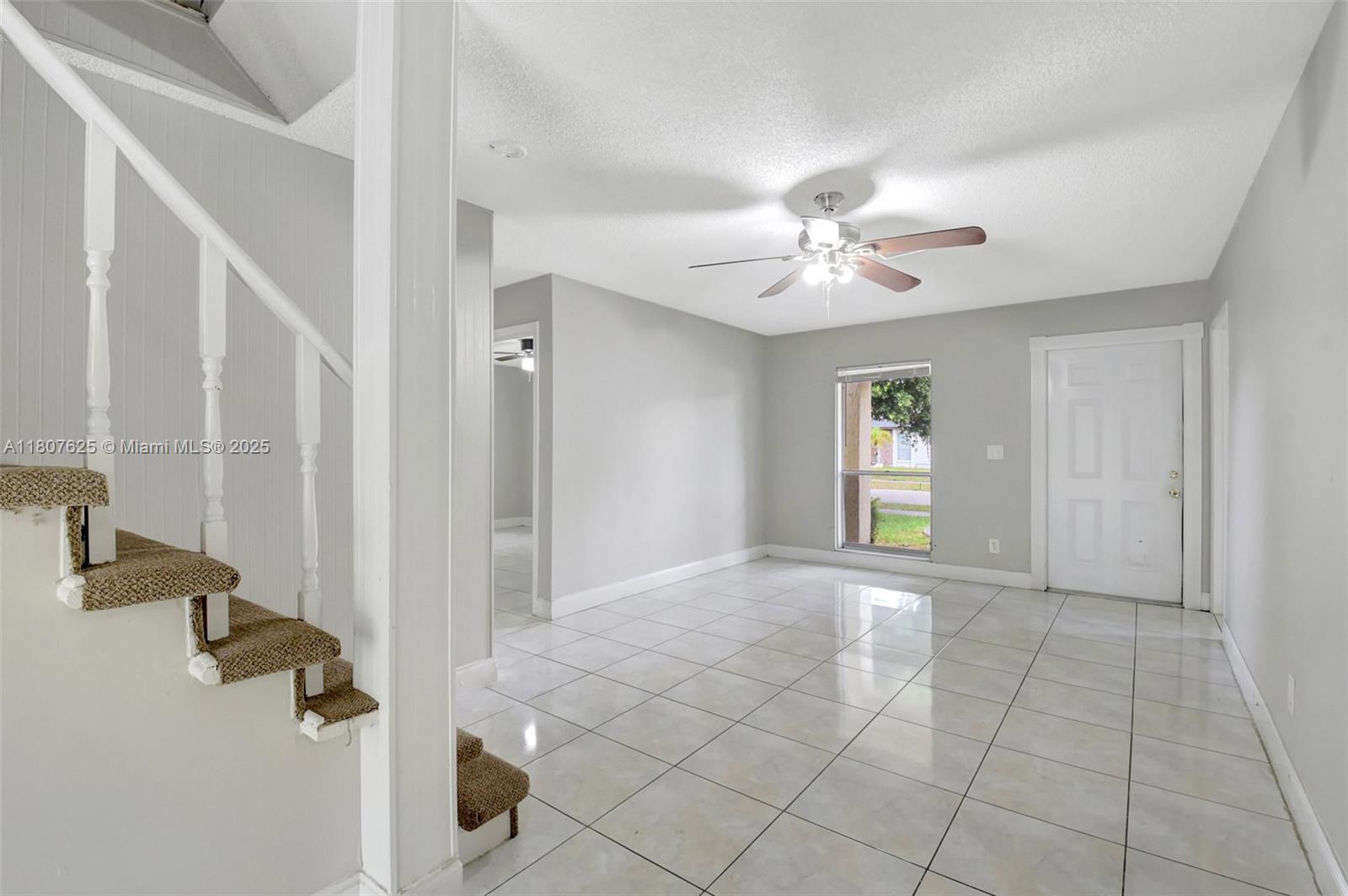 6160 Camp Lee Road West Palm Beach, FL 33417 - Photo 7 of 42 wooden floor in an empty room with a window
