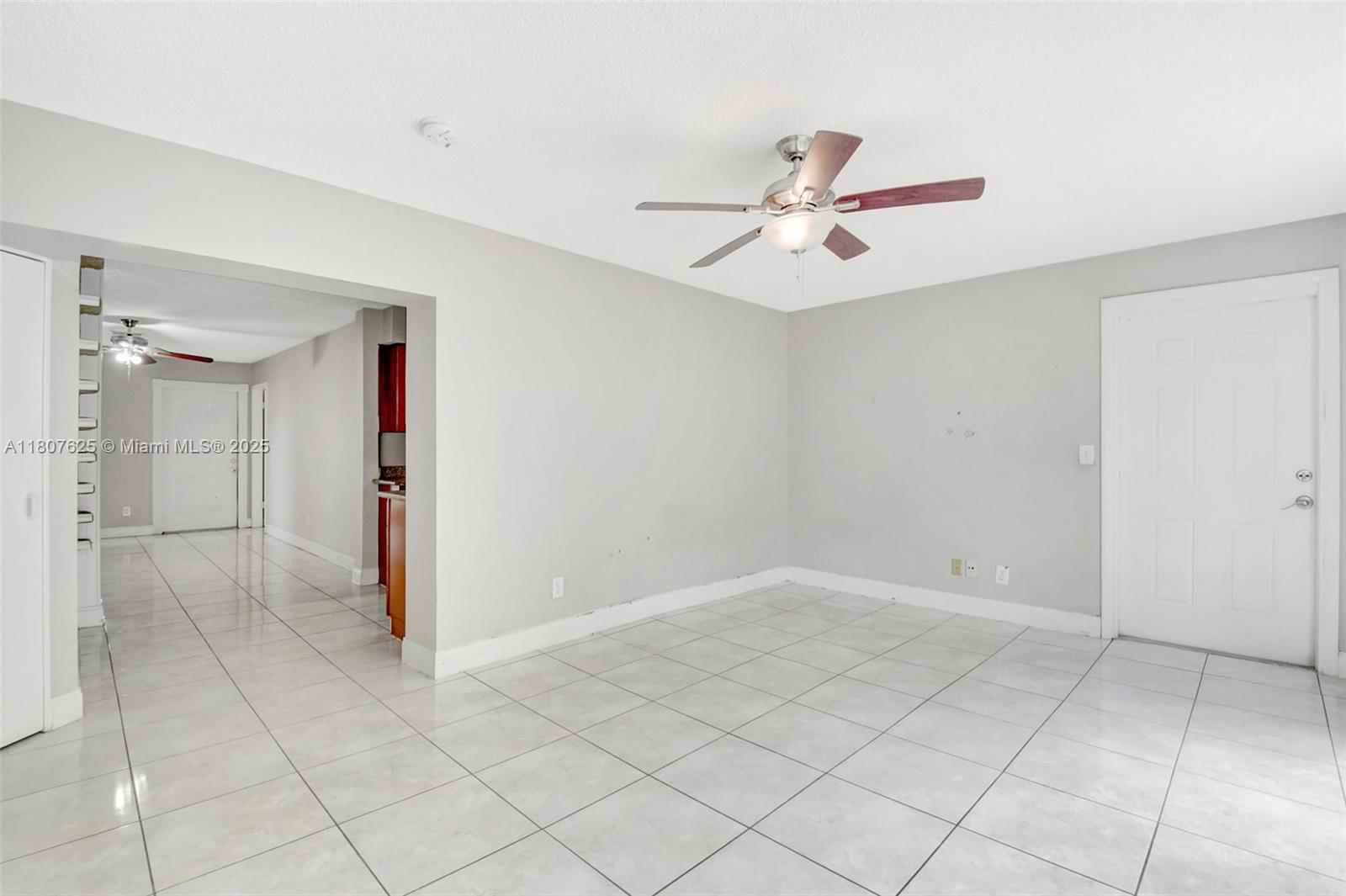6160 Camp Lee Road West Palm Beach, FL 33417 - Photo 9 of 42 an empty room with a ceiling fan and window
