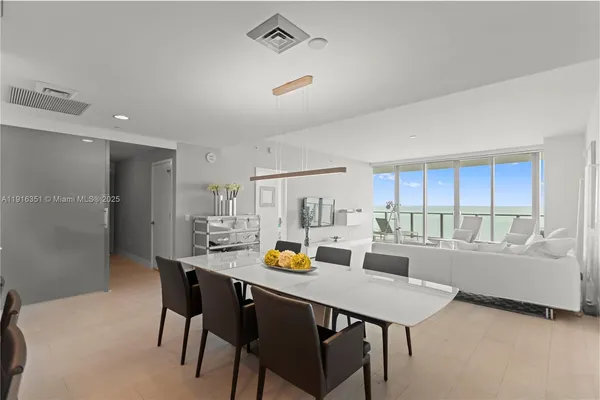 a view of a dining room with furniture window and outside view