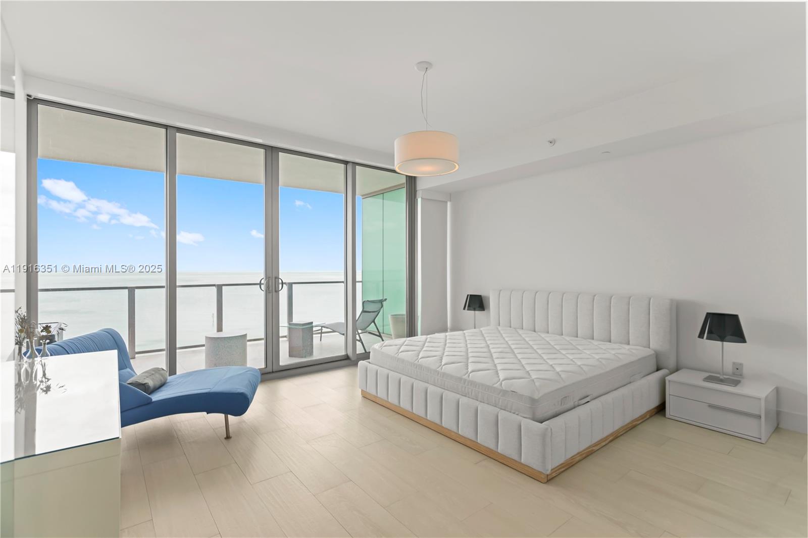 350 Ocean Drive, Unit 904N Key Biscayne, FL 33149 - Photo 16 of 40 a bedroom with a bed and a large window