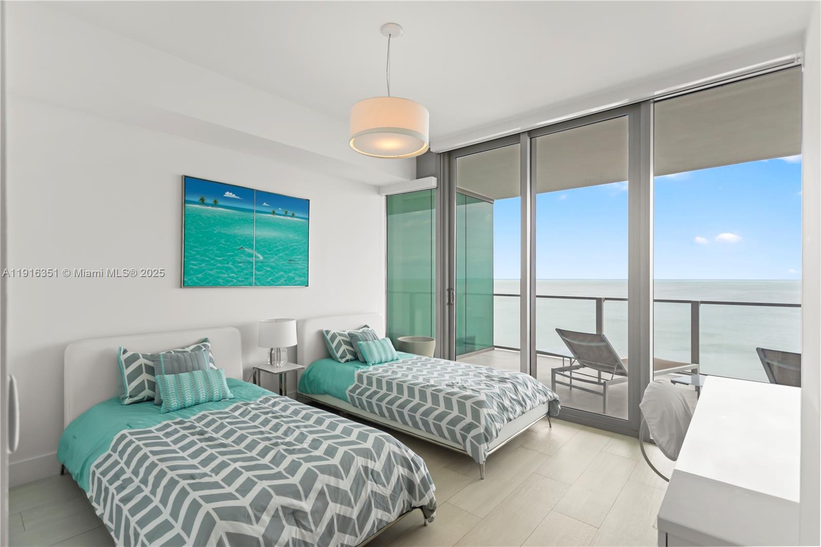350 Ocean Drive, Unit 904N Key Biscayne, FL 33149 - Photo 26 of 40 a bedroom with two beds and a large window