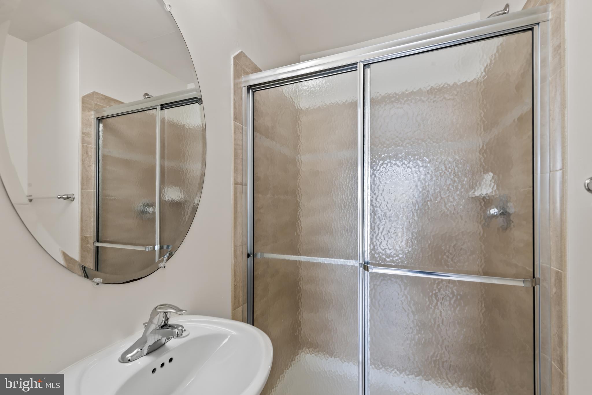 830 Ryan Street Baltimore, MD 21230 - Photo 21 of 24 a bathroom with a glass shower door