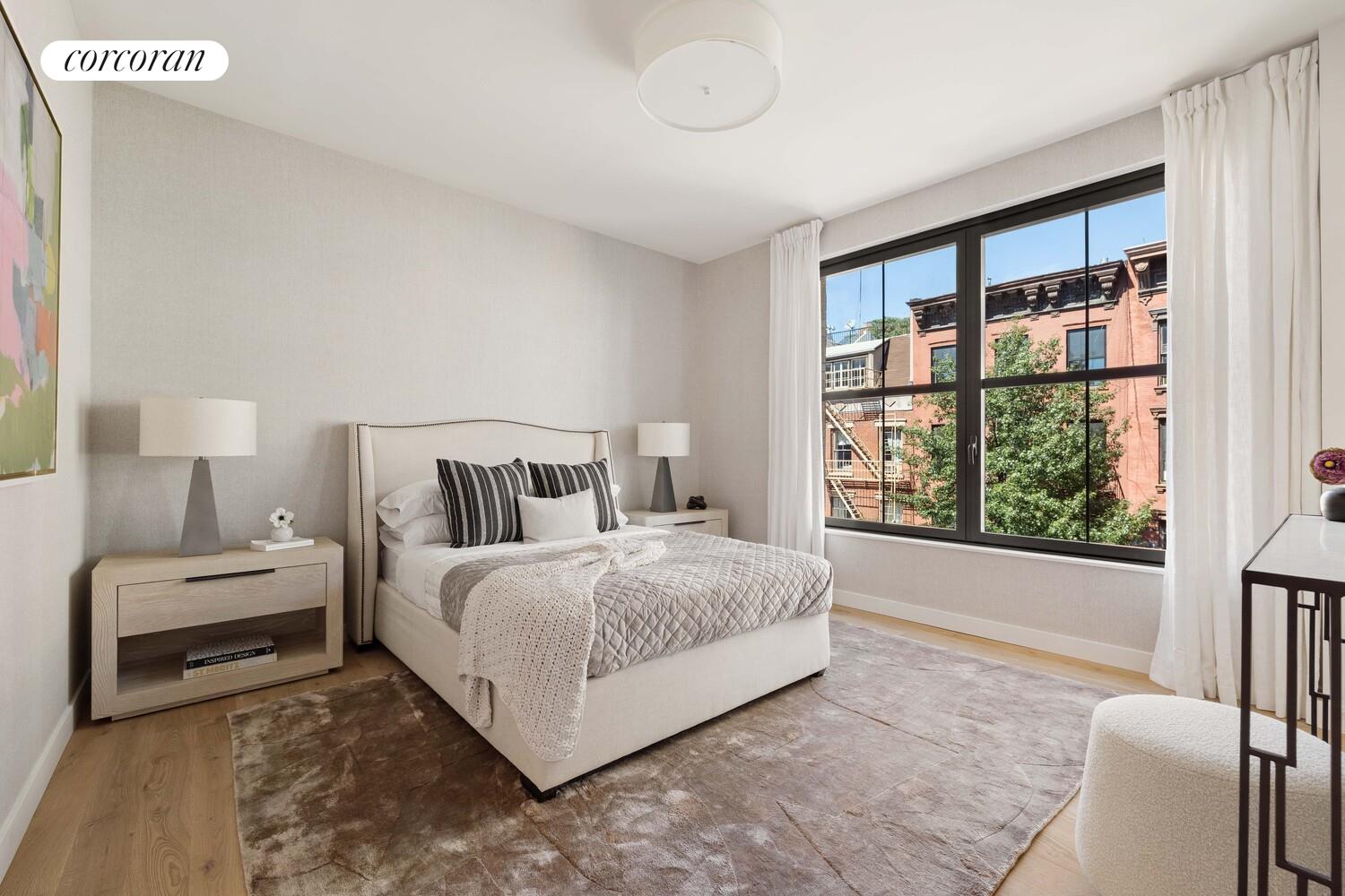 181 MacDougal Street, Unit 4A Manhattan, NY 10011 - Photo 6 of 17 a spacious bedroom with a bed and a large window