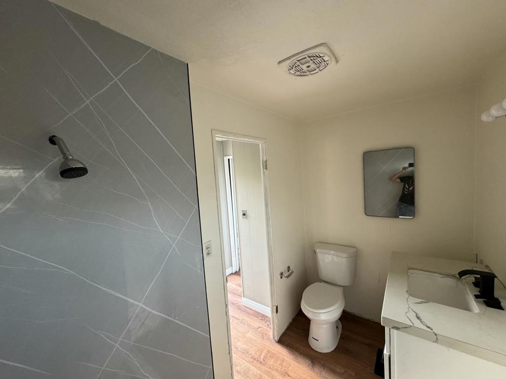 66455 Dillion Road, Unit 43 Desert Hot Springs, CA 92241 - Photo 5 of 8 a bathroom with a toilet and a shower