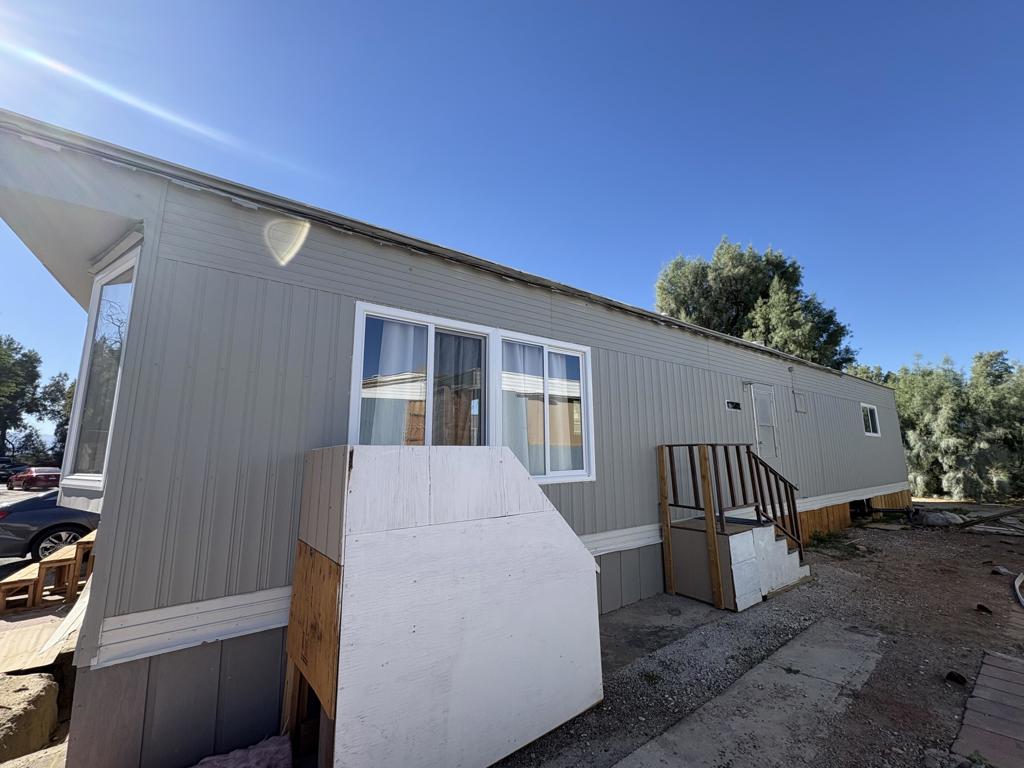 66455 Dillion Road, Unit 43 Desert Hot Springs, CA 92241 - Photo 6 of 8 a view of backyard with barbeque grill and outdoor seating