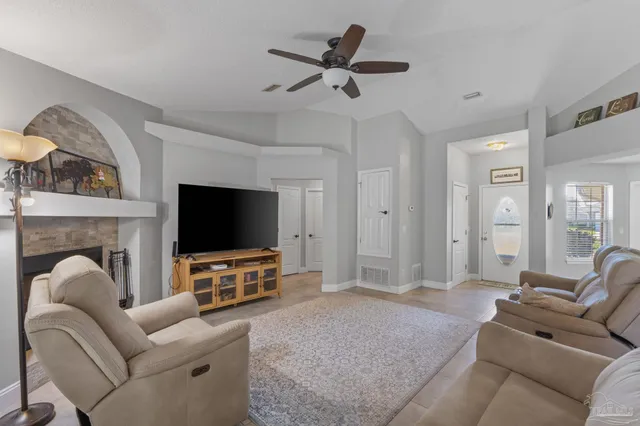 a living room with furniture and a flat screen tv