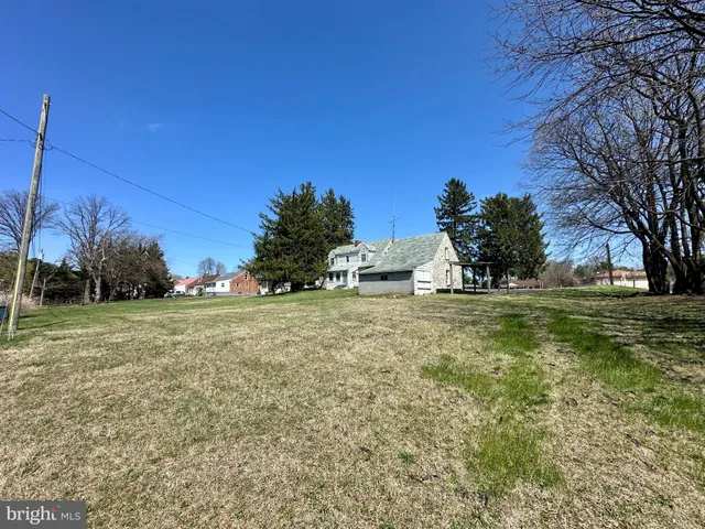 a view of a field with trees