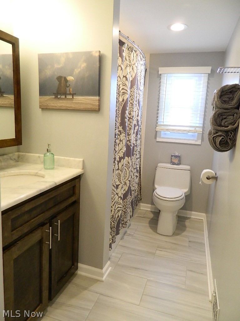 1604 Lyndhurst Road Lyndhurst, OH 44124 - Photo 18 of 35 This Upstairs Full Bath is So Very Spacious and Features Ceramic Flooring, Full Vanity, Can Lighting, Plantation Blinds and a Full Linen Closet Just in the Hallway.