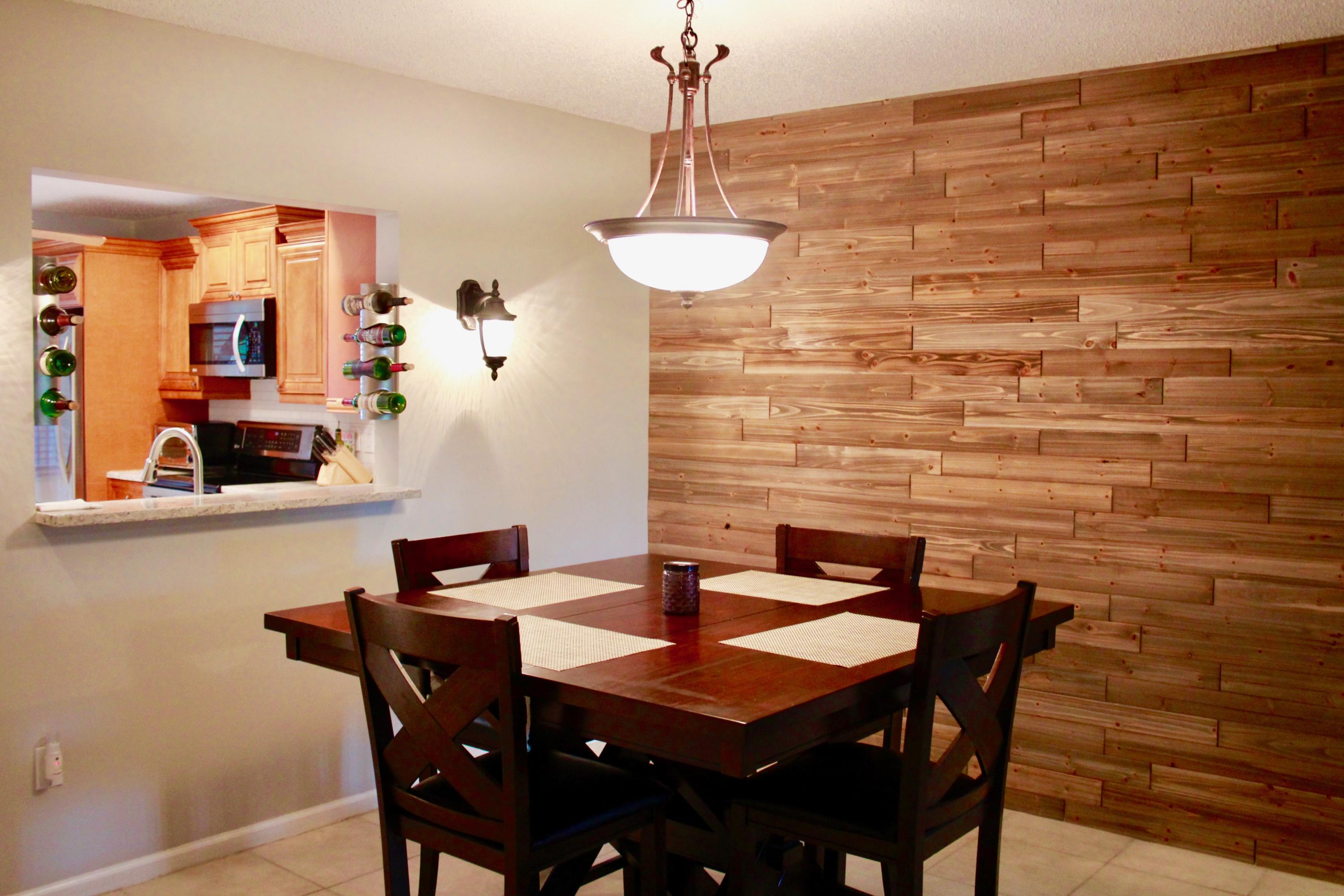 8986 Southwest 19th Street, Unit B Boca Raton, FL 33433 - Photo 14 of 55 a dining room with furniture and wooden floor