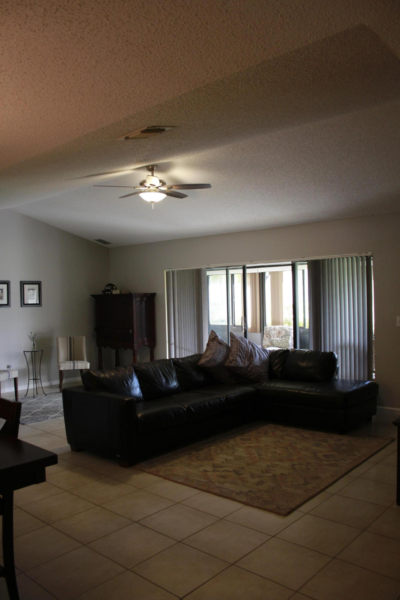 8986 Southwest 19th Street, Unit B Boca Raton, FL 33433 - Photo 15 of 55 a living room with furniture and a large window